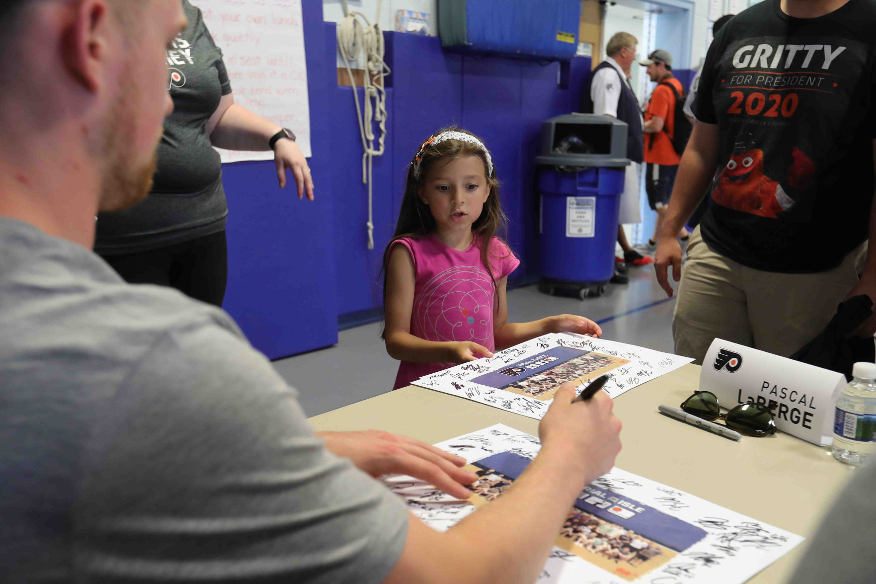 Philadelphia Flyers prospects sign autographs and play volleyball